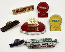 A Collection of 7 Badges with