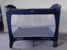 Graco Contour travel cot & playpen. Includes washable mattress topper & bassinet