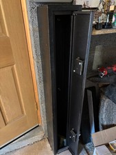 2 gun safety cabinet.  Black Metal. 2 locks. Good condition.