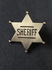 Sheriff pin badge.