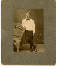 Little Boy Standing by Wicker