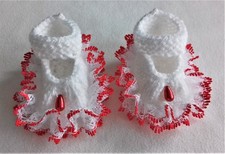 Hand knitted dolls clothes