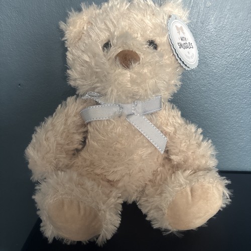 With snuggles teddy - ‘with, snuggles’