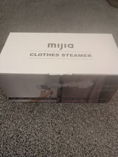 Hand held clothes steamer - hand,