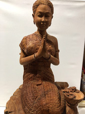 Wood carving of Thai lady