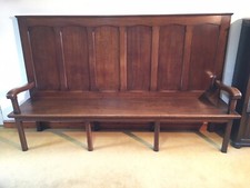 High back oak panelled settle