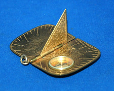 A good antique 19th century pocket sundial compass,  engraved, 1875 date