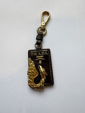 PRADA gold dragon Leather