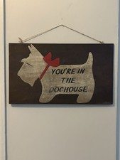 Old vintage wooden sign ‘You’re in the doghouse’