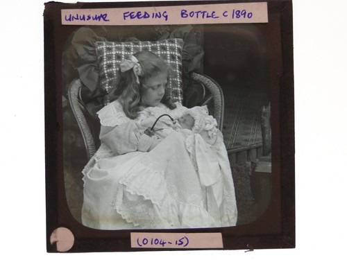 Girl feeding baby unusual tube - baby,