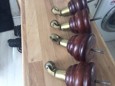 Set of vintage  wooden feet / legs with brass castors