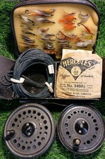 Vintage Fly Fishing Reels, Casts, Flies In Black Japaned Tin And Leather Wallet.