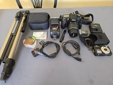 Nikon D7100 DSLR and Nikon Coolpix L22 12MP Camera with tripod and accessories