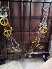 Vintage Christmas Decoration Foil 1980s Garland with Candle Detail.