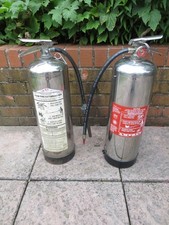 Pair of Chrome finished part used Fire Extinguishers