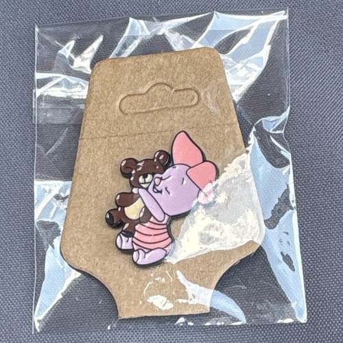 Disney piglet holding teddy - holding,