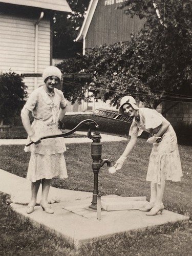 Two women water hand - women, at