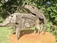 Metal sculpture of mating pigs from Papua New Guinea