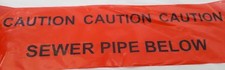 CAUTION SEWER PIPE BELOW Underground warning tape cut lengths