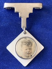 Antique silver badge. Possibly a mourning badge.