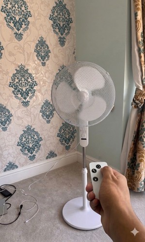 White pedestal fan with - fan, remote