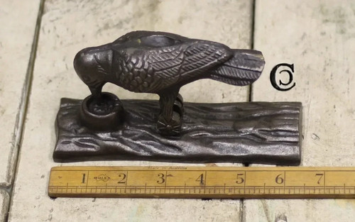 Cast iron woodpecker door - cast,