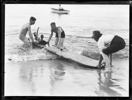 Three men launching - , a