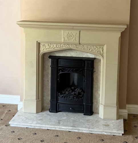 Cream stone fireplace surround - fireplace,