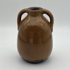 Double handled pottery jug /