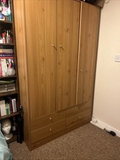 Solid 3 Doors Light Brown Wood Wardrobe with Four Drawers and Hanging Rod