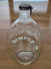 Collectible Dimple Haig whisky bottle with metal spring top