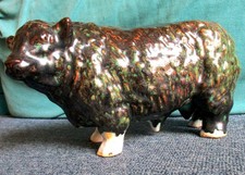 Unusual vintage pottery hereford bull figure 9 inches long, drip glaze