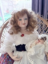 Vintage Ceramic Porcelain Doll In Wicker Chair