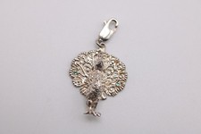 Milano silver clip on peacock