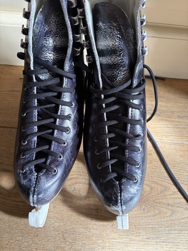 Black figure ice skates - ice, with