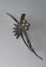 Antique sterling silver and marcasite brooch with pearls. Good barrel catch.