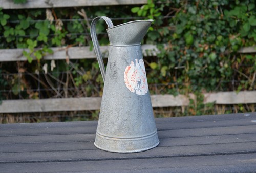 Vintage old aluminium milk