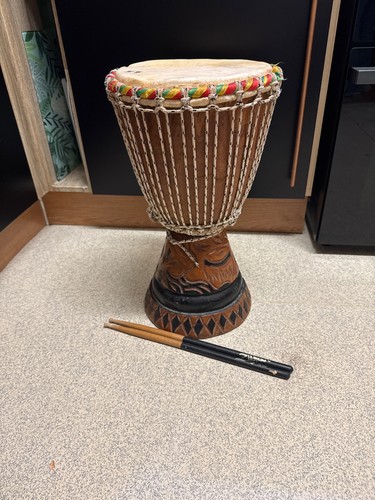 Hand carved wooden djembe - hand,