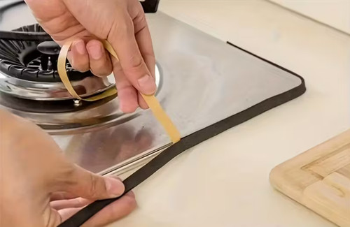 Hob work surface seal self - work,