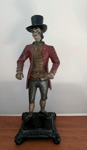 Vintage cast iron man - iron, clock