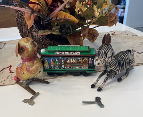Three vintage tin - up, toys