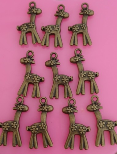 Ten metal charms - , for