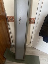 Two Gun Cabinet with Keys & Two Gun Sleeves. Very Good Condition