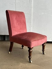 A Victorian walnut slipper chair