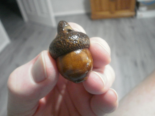 Carved wood netsuke acorn