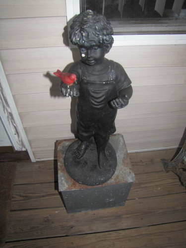 Girl boy holding red - girl/boy?, bird