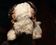 antique toy dog requiring a restoration
