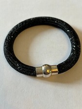 Small lozenge shaped wooden effect bracelet with small silver spacer beads