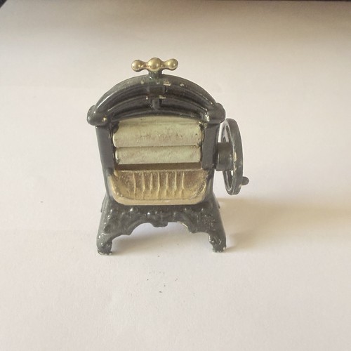 Painted brass mangle doll - brass,