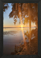 Sunset over water with Spanish